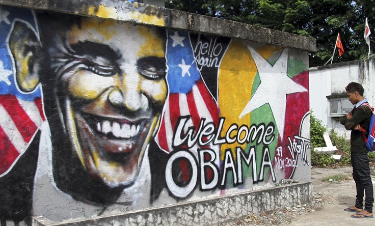 A man looks at a graffiti painted by Myanmar artist Arker Kyaw to welcome U.S. President Barack Obama on a street in Yangon, Myanmar, Saturday, Nov. 17, 2012. Word of Obama's historic visit has spread quickly around Yangon, which is readying itself with legions of hunched workers painting fences and curbs, pulling weeds and scraping grime off old buildings in anticipation of the president's Monday arrival. (AP Photo/Khin Maung Win)
