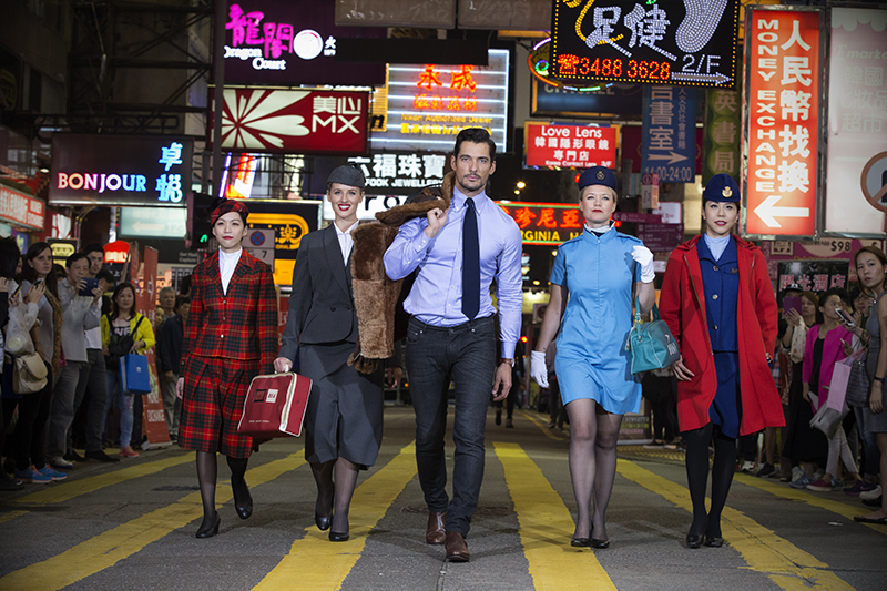 celebrates 80 years of flying to HKG in style with supermodel David Gandy with BA cabin crew in various vintage uniforms