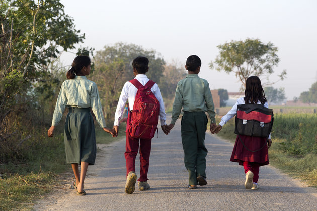 Indian school children walking to school