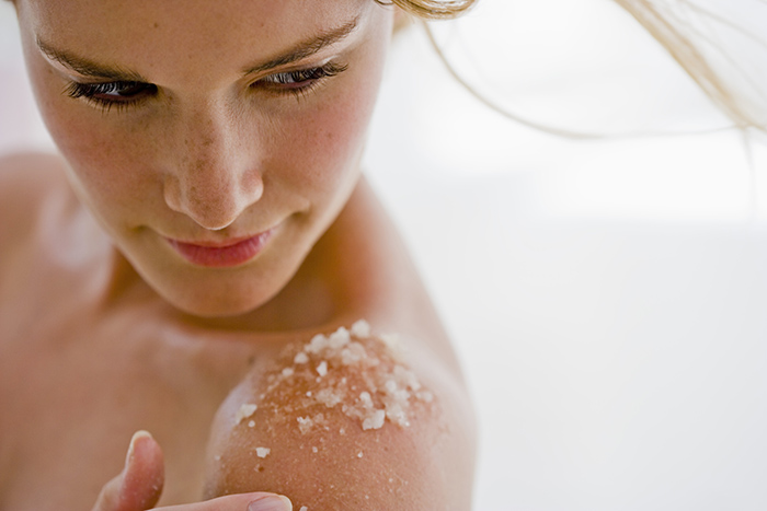 Woman using body salts