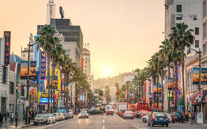 LOS ANGELES - DECEMBER 18, 2013: View of Hollywood Boulevard at sunset. In 1958, the Hollywood Walk of Fame was created on this street as a tribute to artists working in the entertainment industry.; Shutterstock ID 186048416