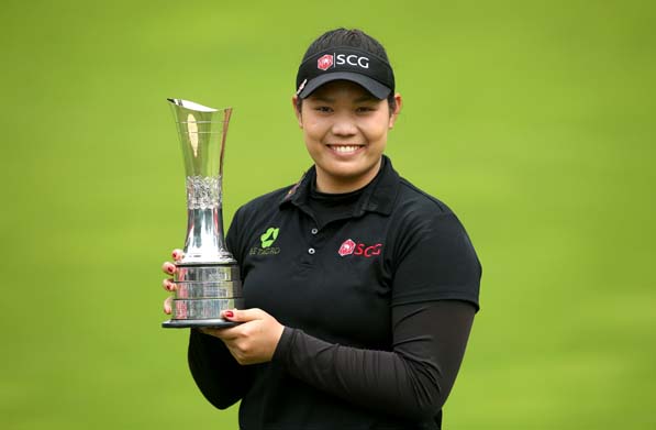 Thailand's Ariya Jutanugarn poses with her trophy after winning the Women's British Open during day four of the Women's British Open at Woburn Golf Club, Woburn, England, Sunday July 31, 2016. (Steve Paston / PA via AP)