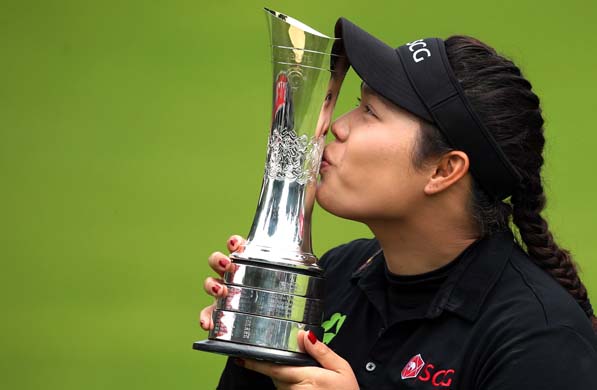 Thailand's Ariya Jutanugarn poses with her trophy after winning the Women's British Open during day four of the Women's British Open at Woburn Golf Club, Woburn, England, Sunday July 31, 2016. (Steve Paston / PA via AP)