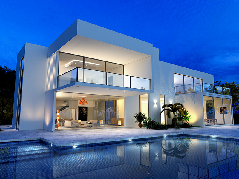 luxurious villa with swimming pool at dusk